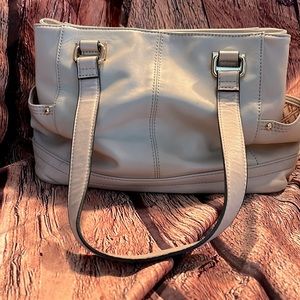Beautiful leather tignanello bag to tone a light blush/light cream color used